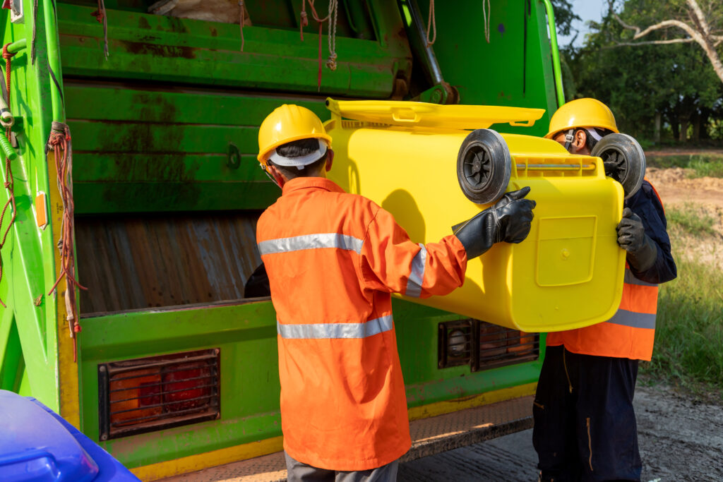 Workers collect garbage